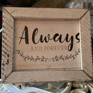 Antique white wooden frame framing Always and Forever sign.